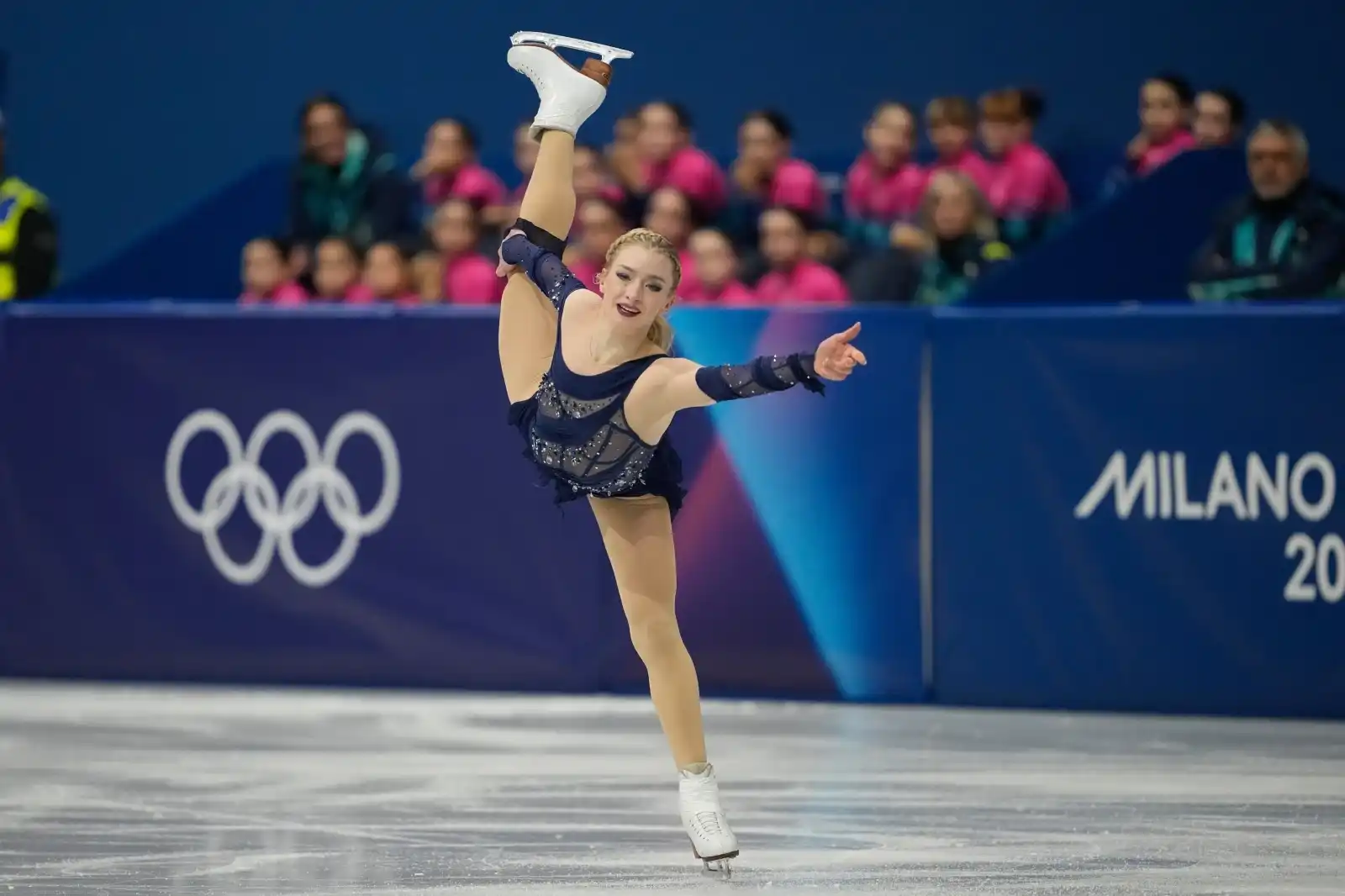 Amber Glenn performing a graceful free skate at the 2026 Winter Olympics in Milan Cortina.