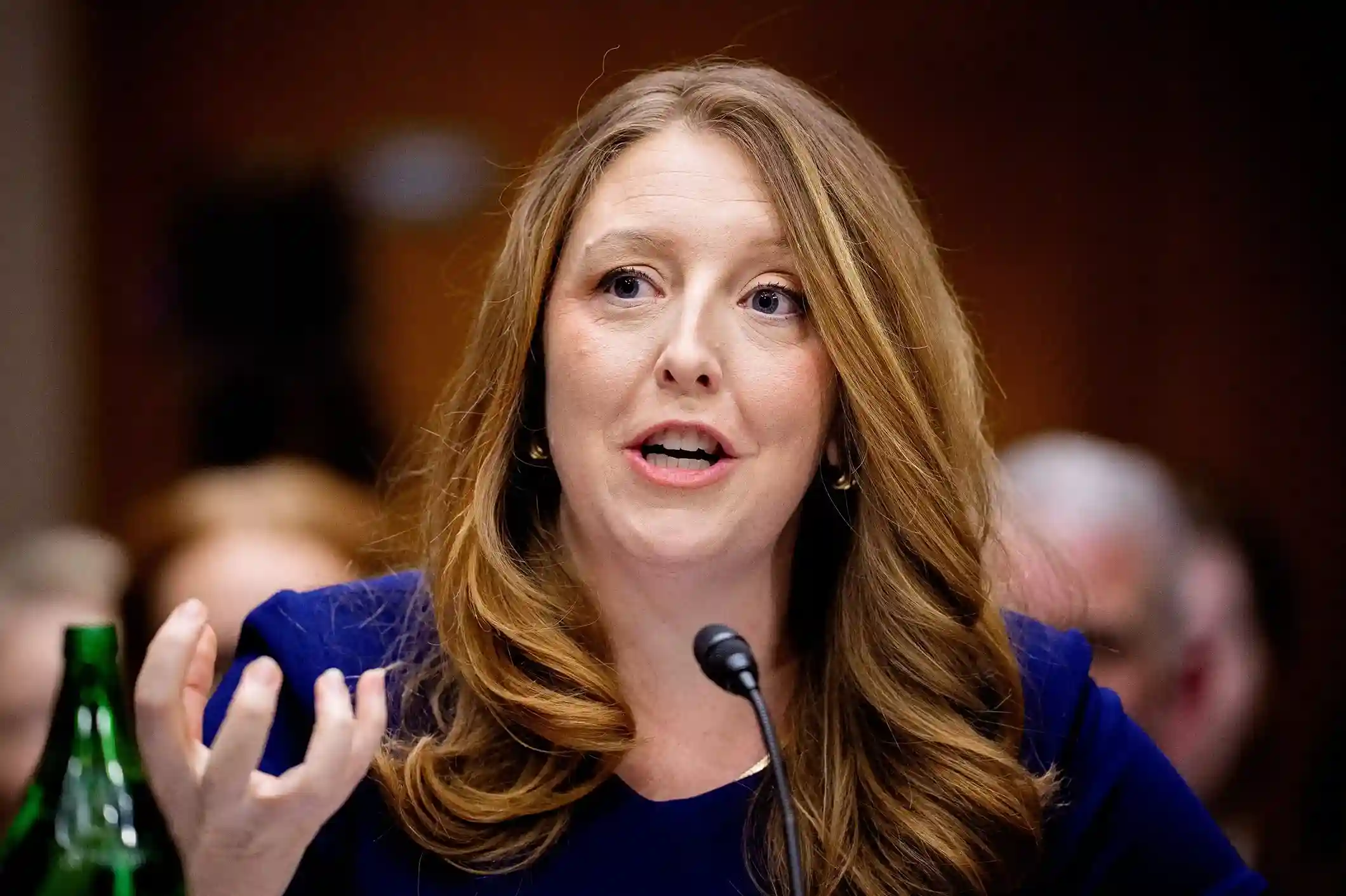Close-up of Surgeon General nominee Dr. Casey Means speaking about vaccines and public health during a Senate confirmation hearing.